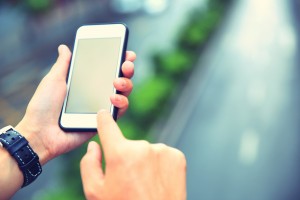 young asian woman hands use smartphone at city