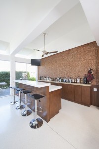 Bar counter and bottles with high white ceiling